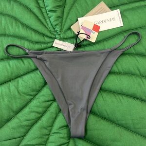 Brand new, never worn, NWT Dos Gardenias string bikini bottom, grey. Size 4.
